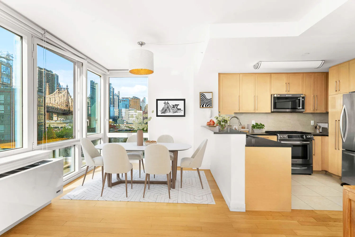 a view of a dining room with furniture a chandelier and wooden floor