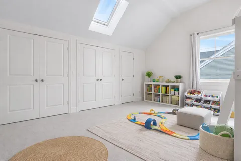 a living room with furniture and next to a window
