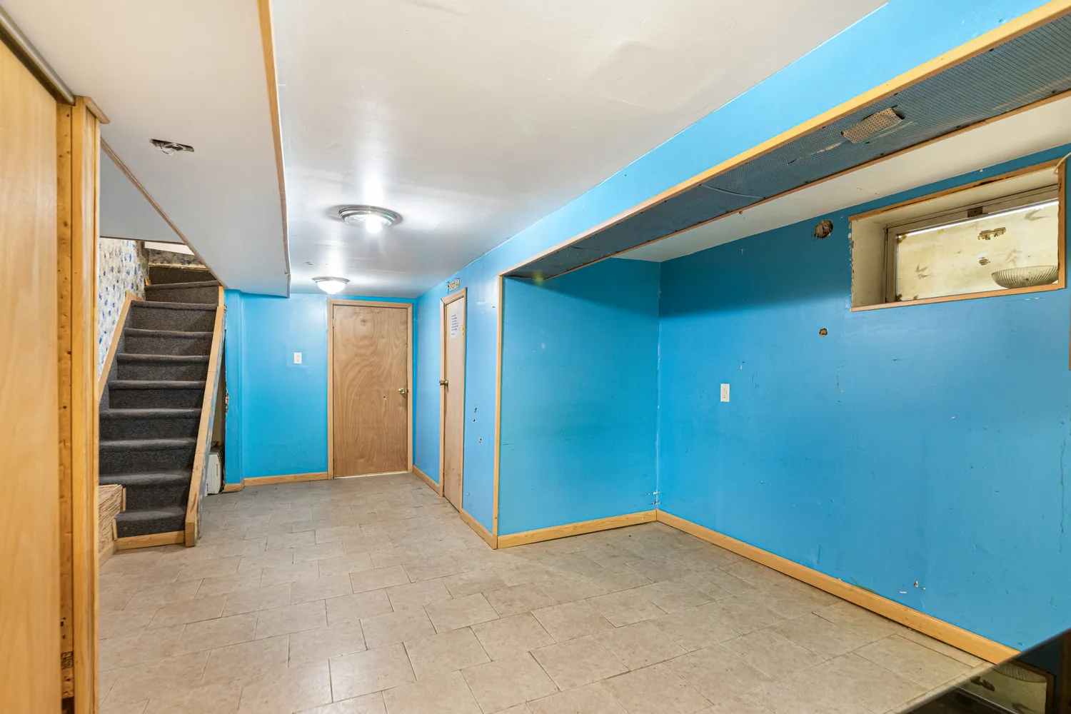 a view of an empty room with stairs
