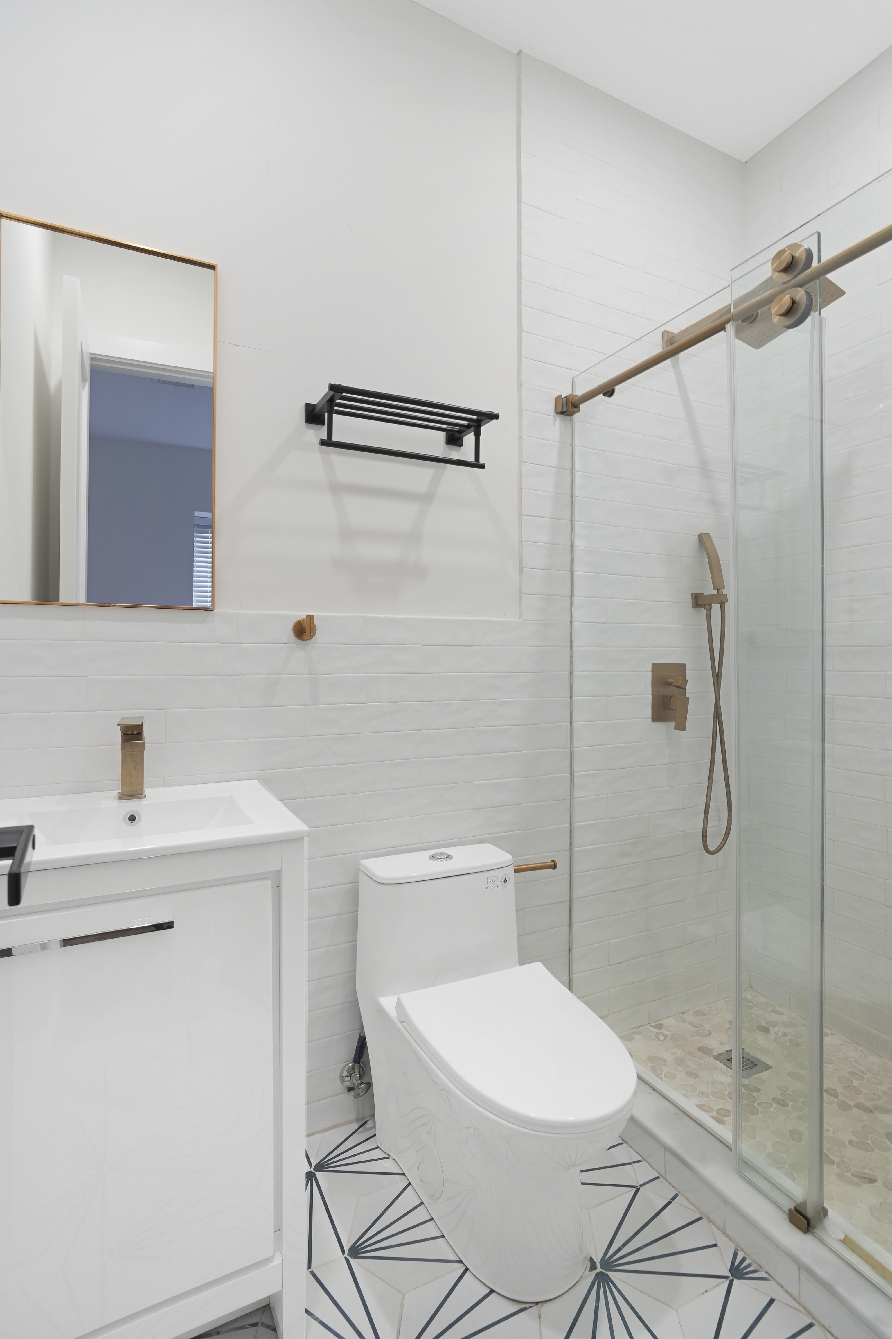 1390 Eastern Parkway Brooklyn, NY 11233 - Photo 12 of 19 a white toilet sitting next to a bathroom sink