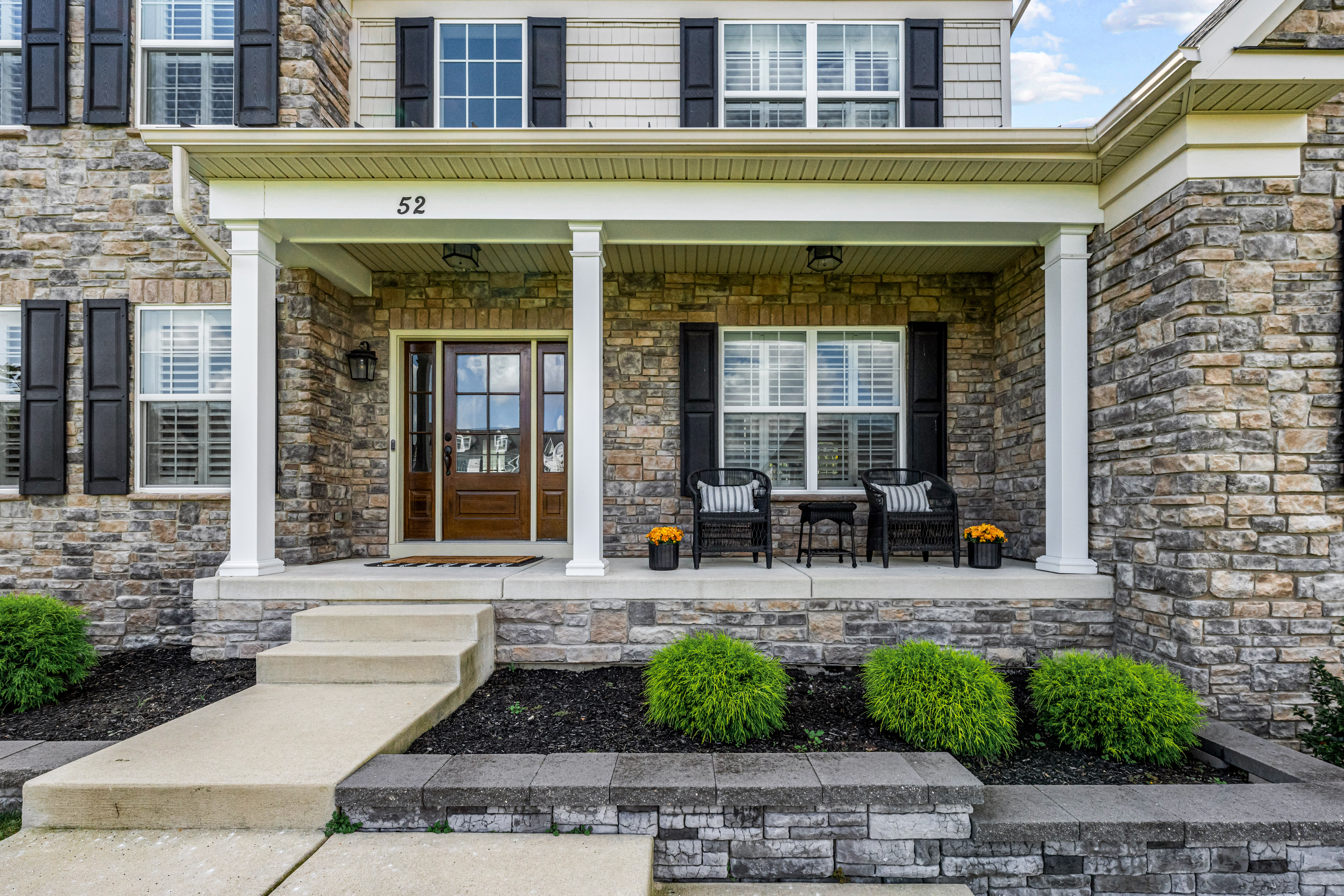 52 Wellesley Way Marlton, NJ 08053 - Photo 6 of 98 a front view of a building with outdoor seating area and windows