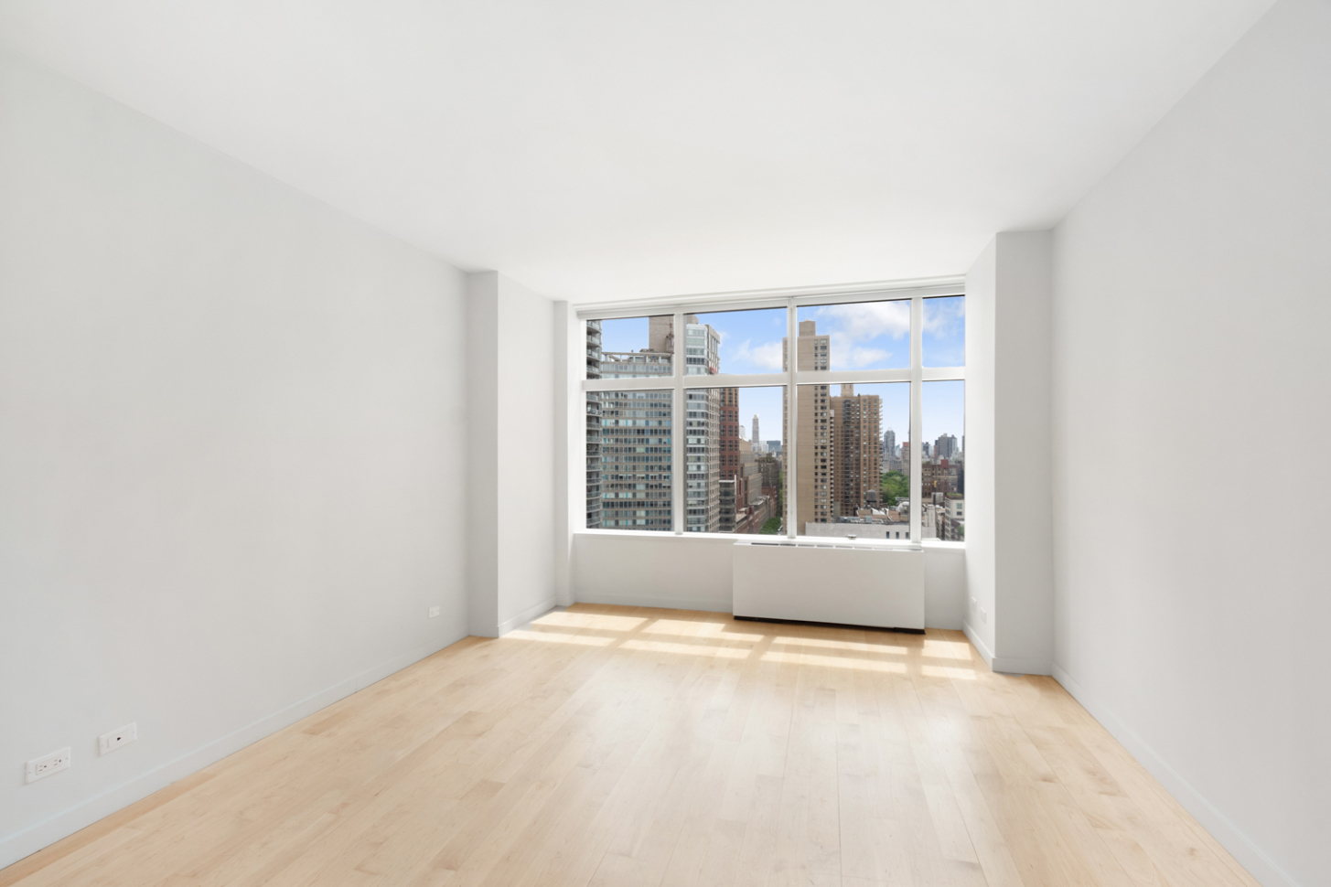 160 West 66th Street, Unit 20F Manhattan, NY 10023 - Photo 5 of 7 a view of an empty room with a window