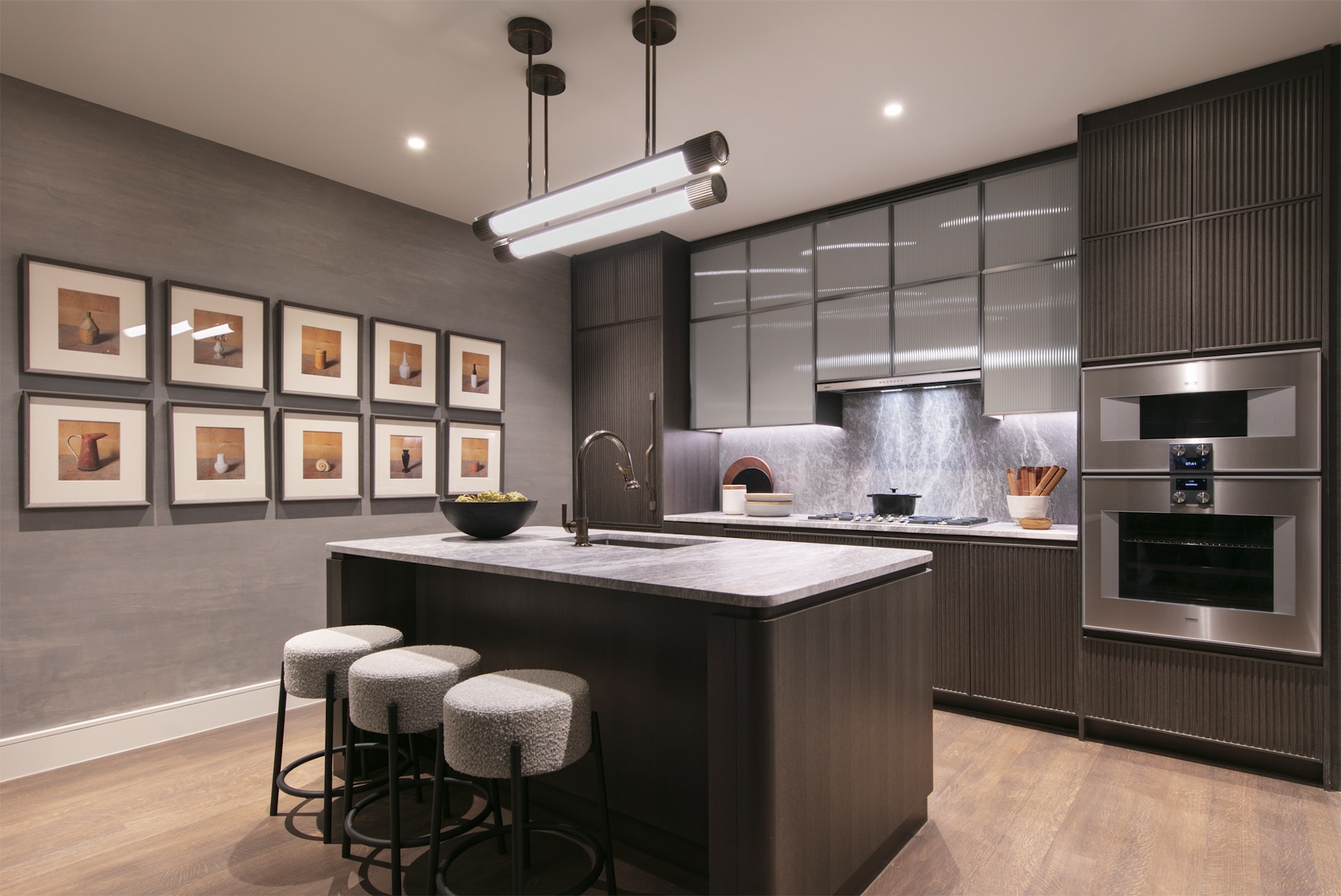 515 West 18th Street, Unit 805 Manhattan, NY 10011 - Photo 2 of 6 a kitchen with stainless steel appliances granite countertop a sink a stove and a refrigerator