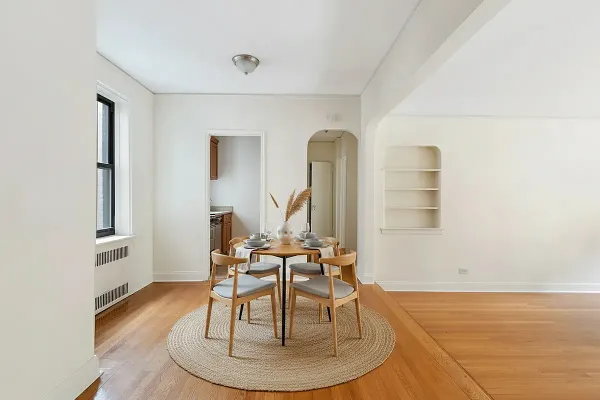 a view of a livingroom with furniture and hardwood floor