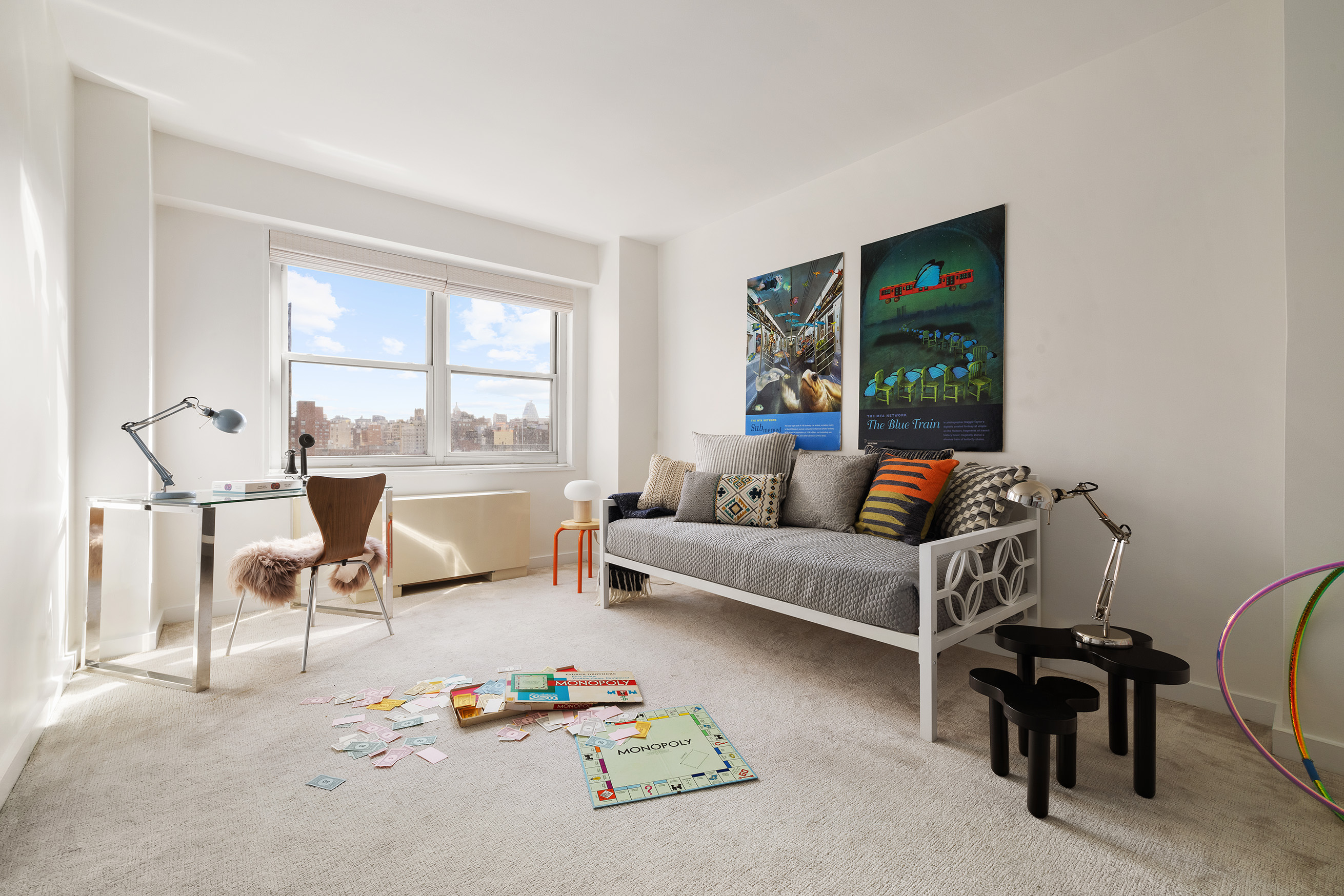 360 West 22nd Street, Unit 12B Manhattan, NY 10011 - Photo 9 of 16 a living room with furniture and a large window