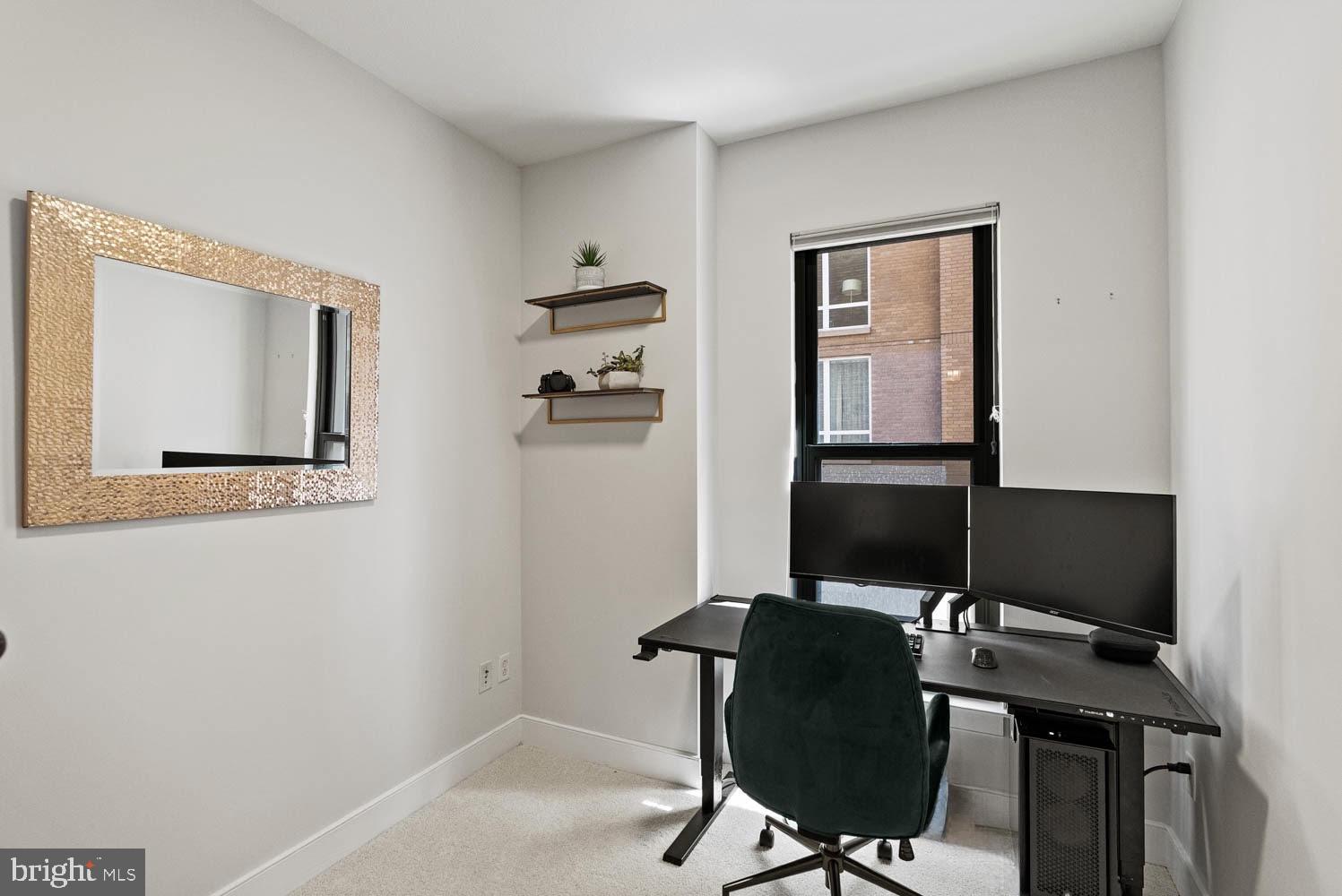 910 M Street Northwest, Unit 403 Washington, DC 20001 - Photo 17 of 31 a view of a workspace with furniture