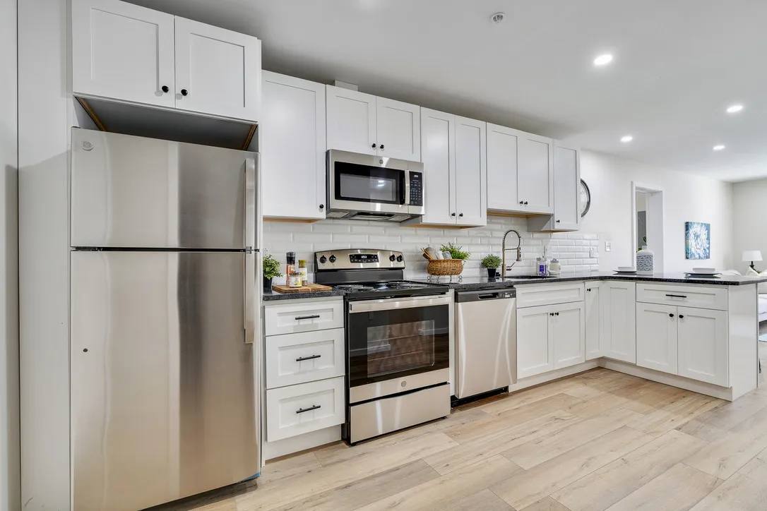 a bedroom with a bed and windows