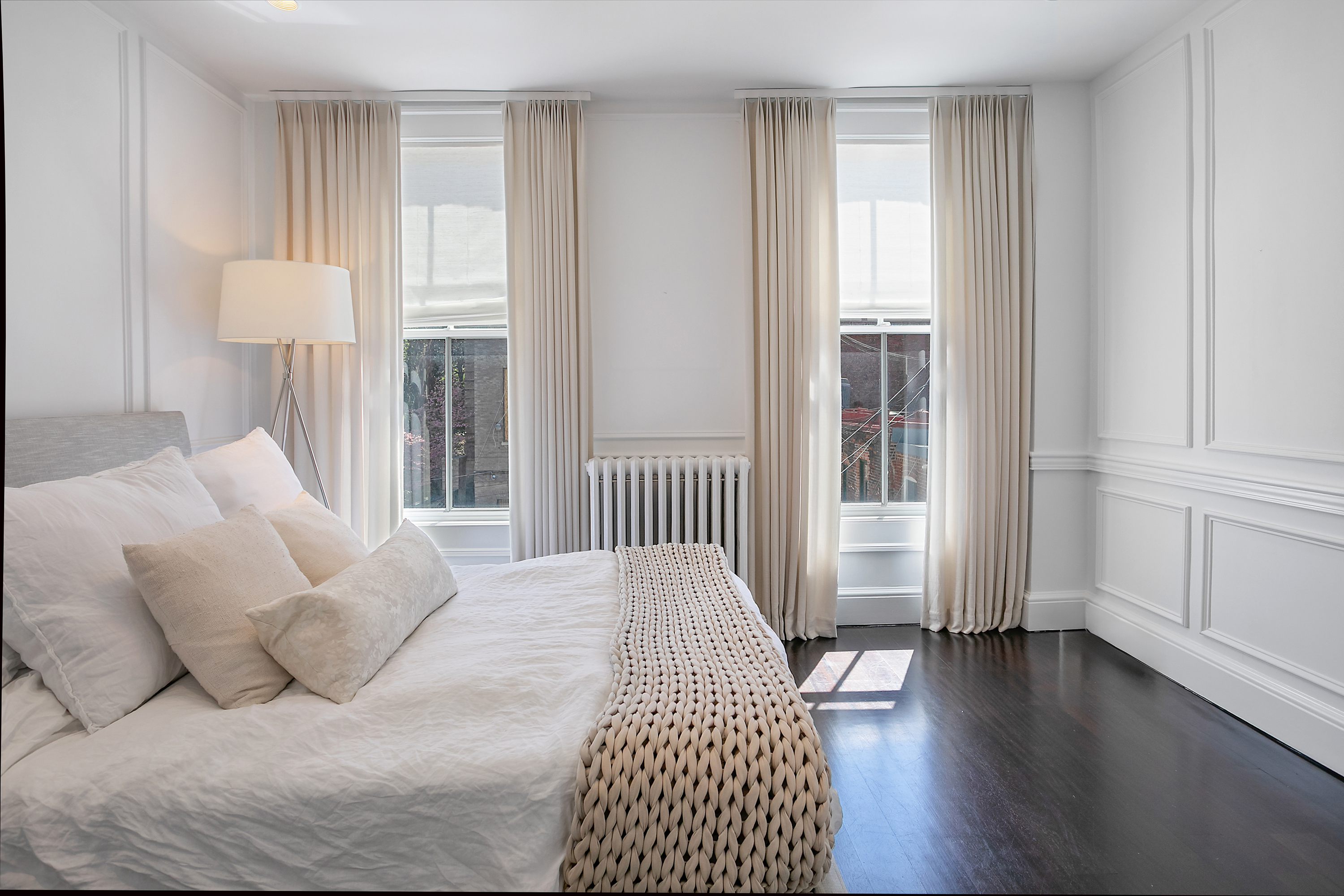 1832 Corcoran Street Northwest Washington, DC 20009 - Photo 11 of 29 a bedroom with a bed and wooden floor