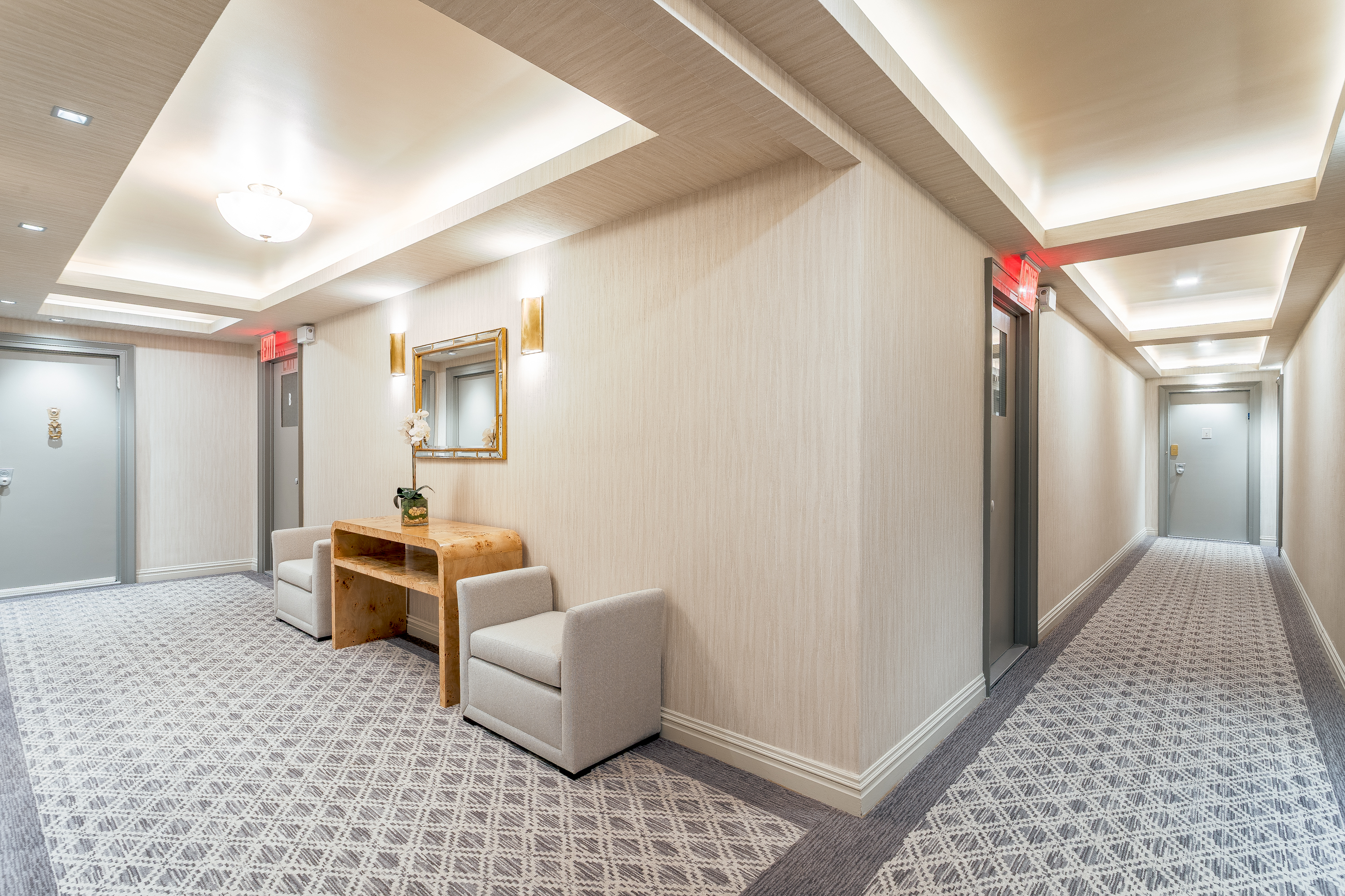 150 East 69th Street, Unit 5C Manhattan, NY 10021 - Photo 14 of 15 a hallway with furniture and a rug