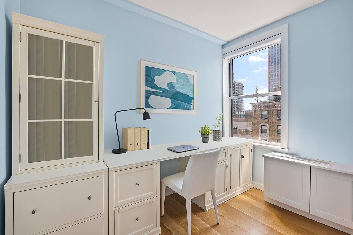 240 West End Avenue, Unit PH Manhattan, NY 10023 - Photo 12 of 25 a white kitchen with a sink cabinets and wooden floor