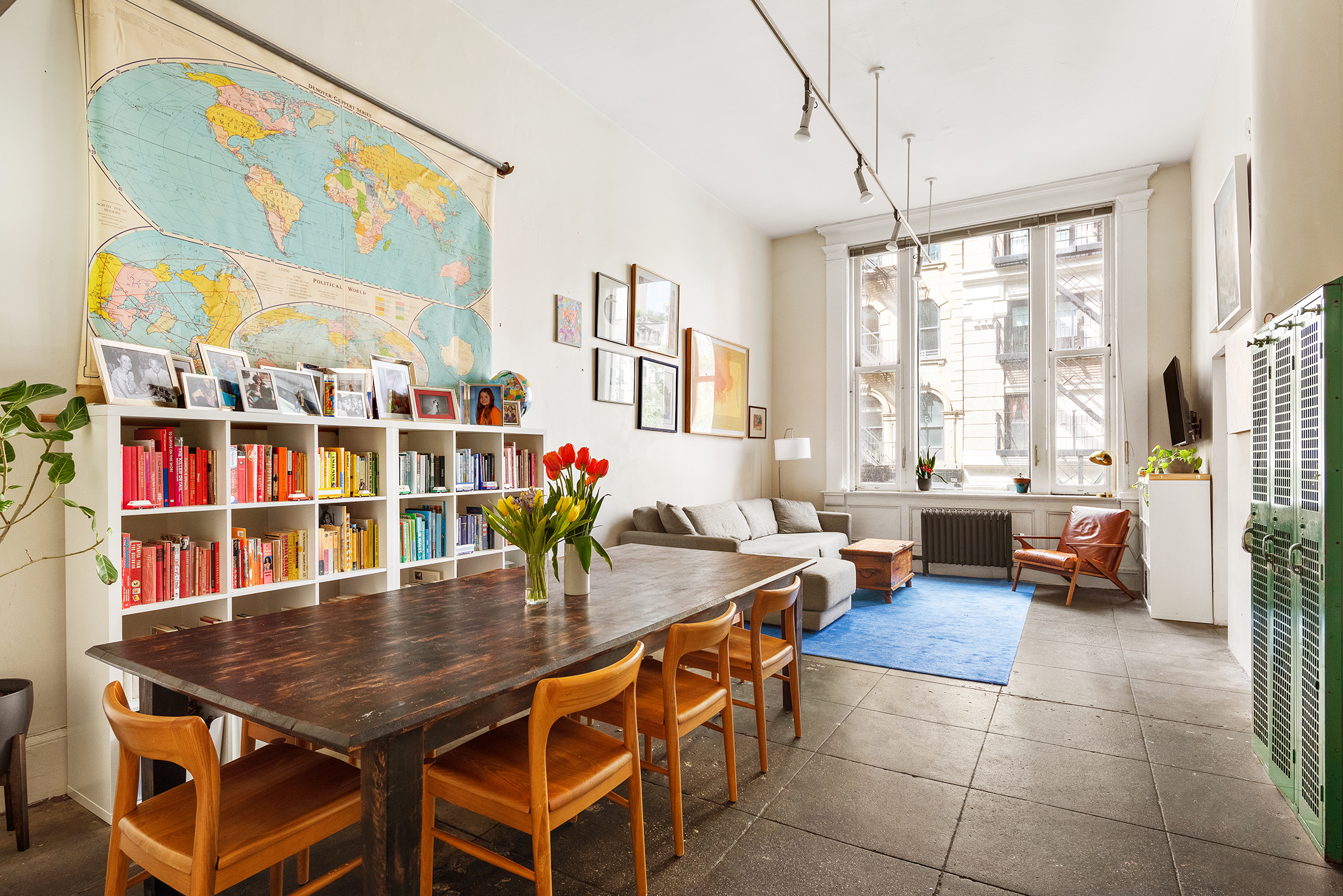 a room with furniture and a potted plant
