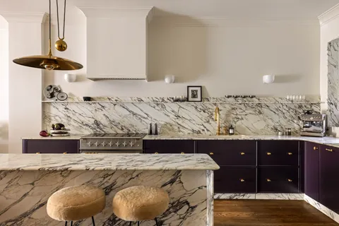 a kitchen with a sink stove and window