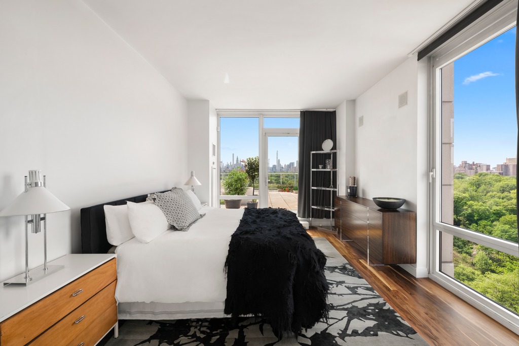 111 Central Park North, Unit PHB Manhattan, NY 10026 - Photo 12 of 17 a bed room with a bed and a large window