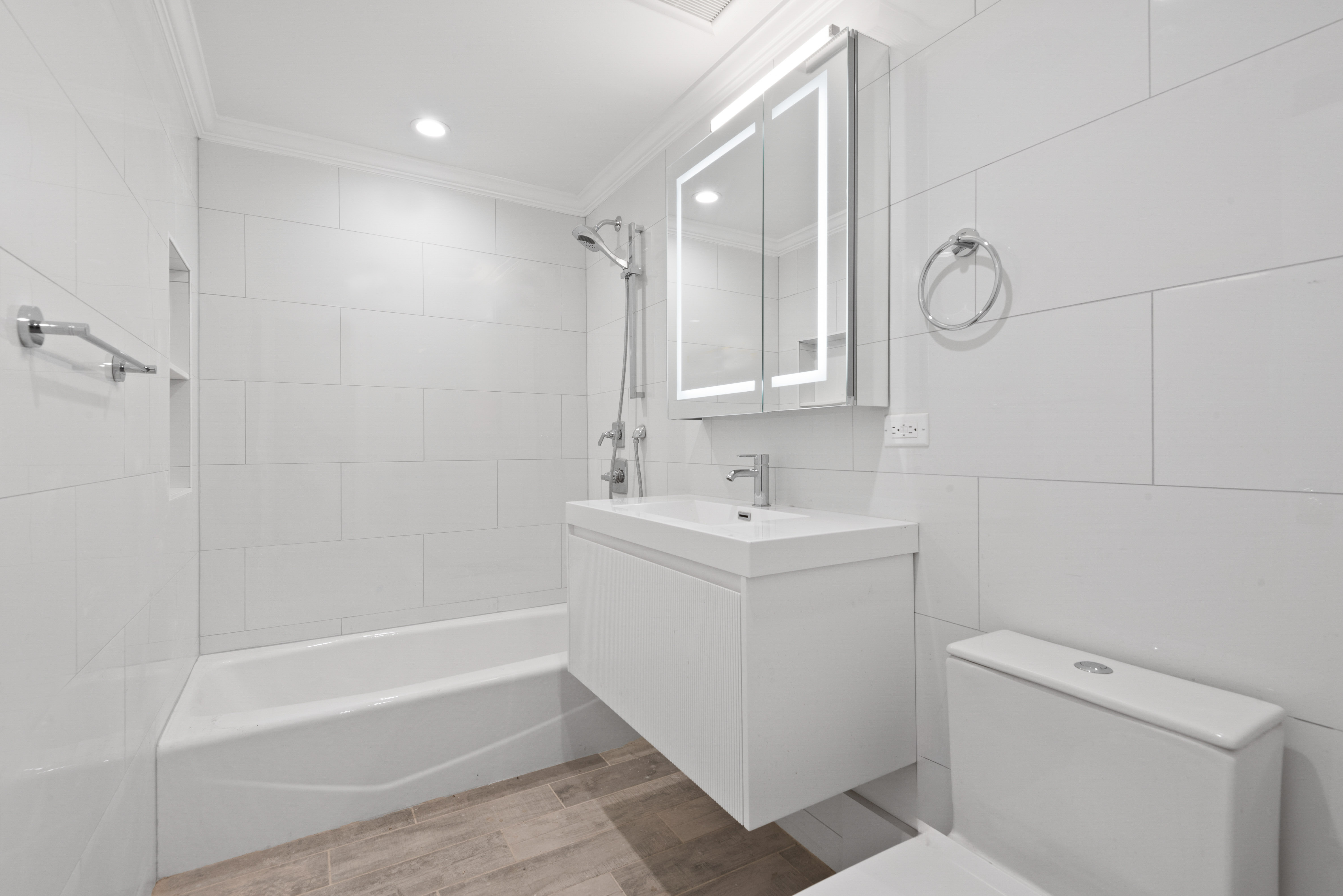 560 Hancock Street, Unit 2 Brooklyn, NY 11233 - Photo 4 of 6 a view of bathroom with bathtub and toilet