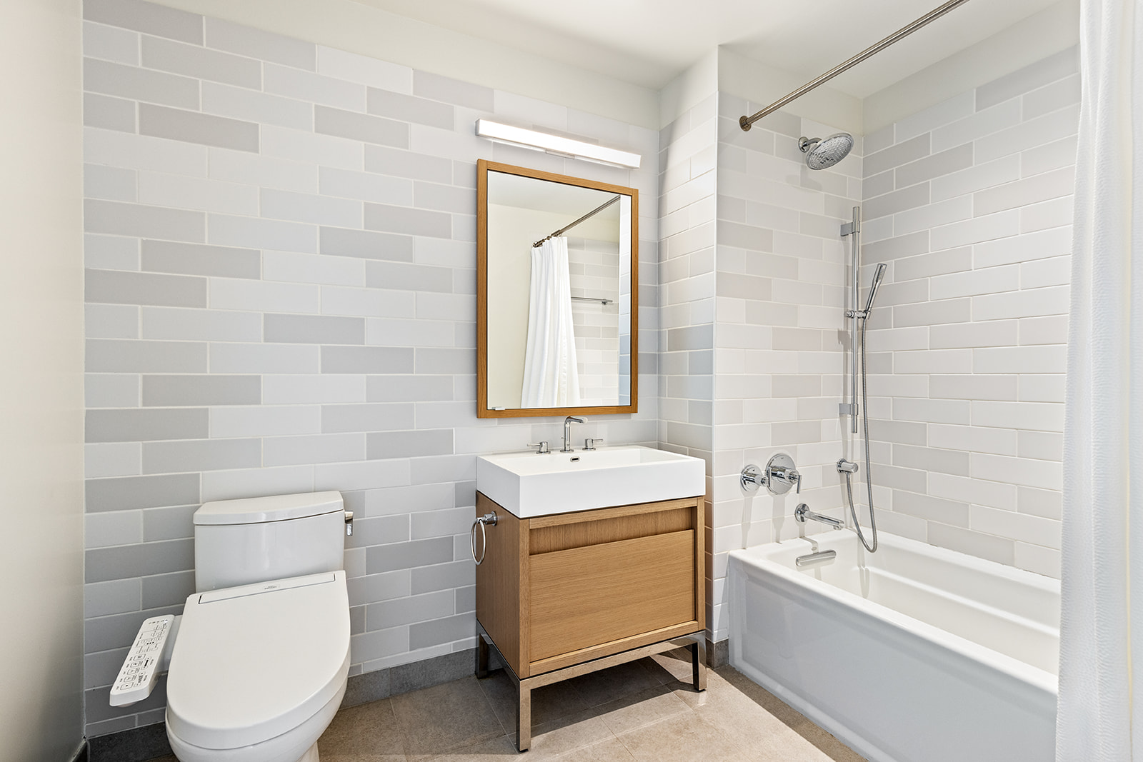 550 Vanderbilt Avenue, Unit 1508 Brooklyn, NY 11238 - Photo 9 of 17 a bathroom with a sink toilet and bathtub