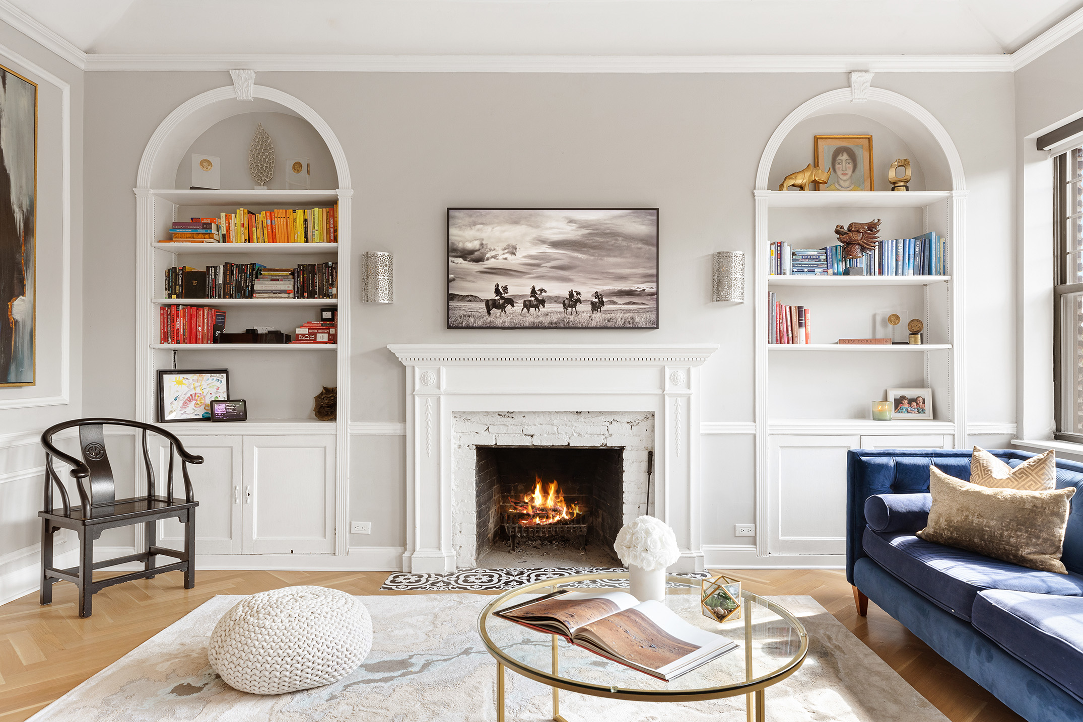 a living room with furniture and a fireplace