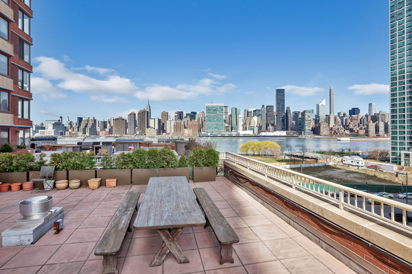 4-74 48th Avenue, Unit 34G Queens, NY 11109 - Photo 5 of 9 a view of a city with tall buildings