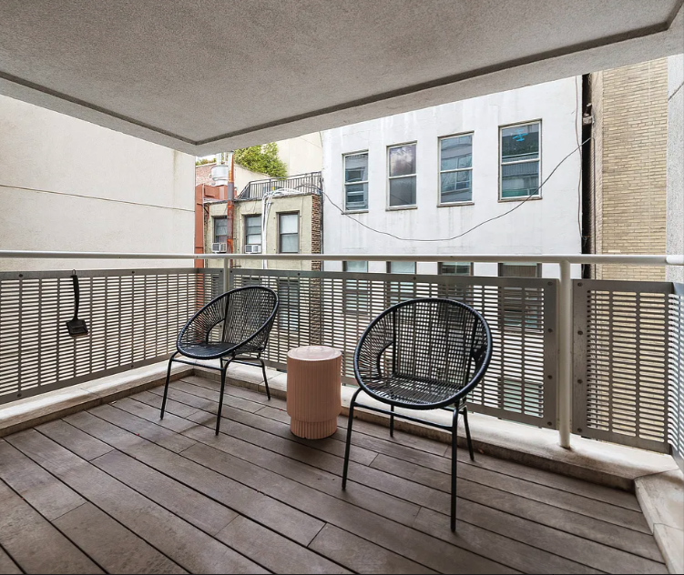 16 Warren Street, Unit 5 Manhattan, NY 10007 - Photo 14 of 18 a view of a deck with wooden floor and outdoor seating