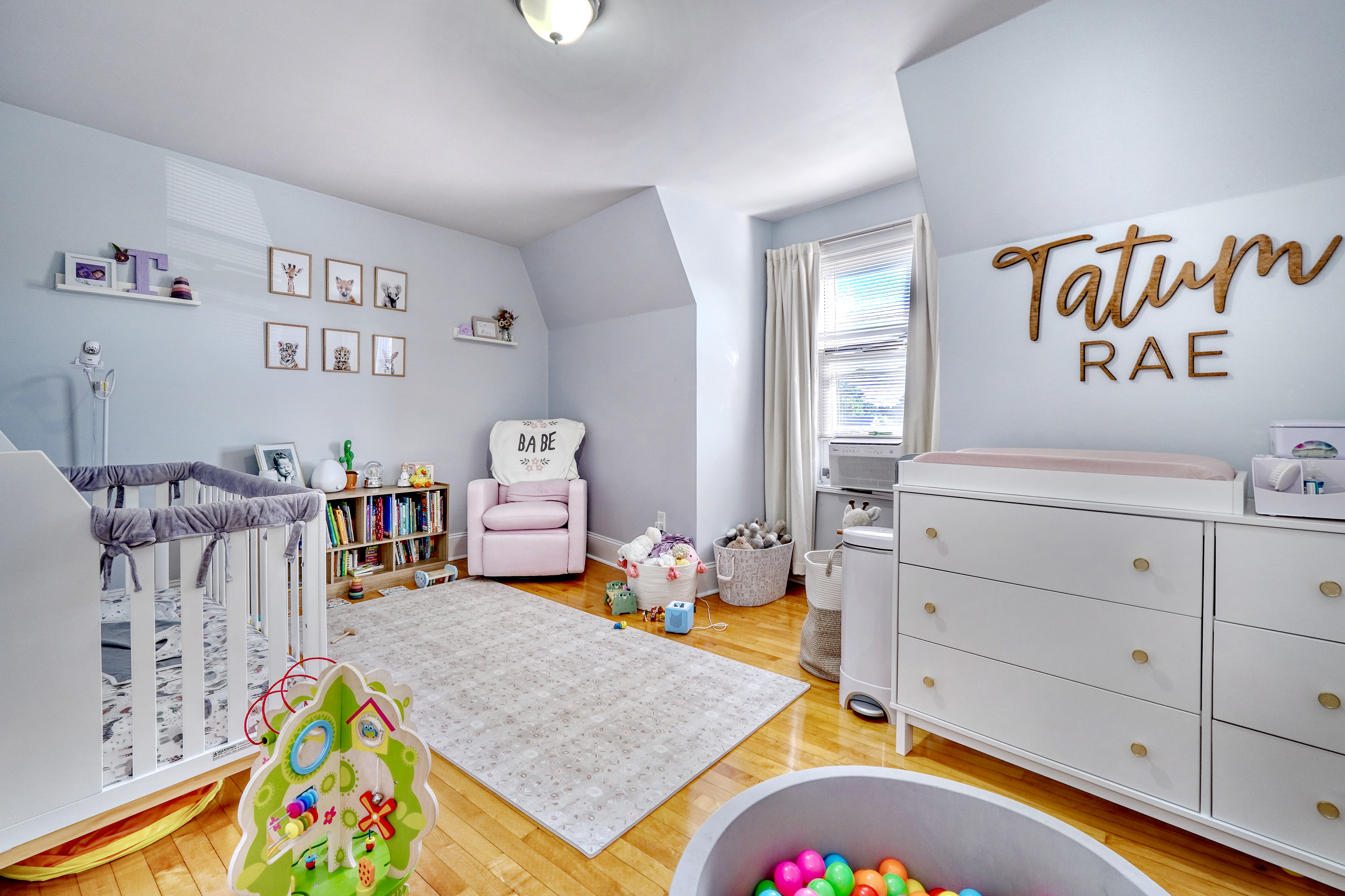 437 High Street Medford, MA 02155 - Photo 6 of 12 a bed room with a bed and a couch