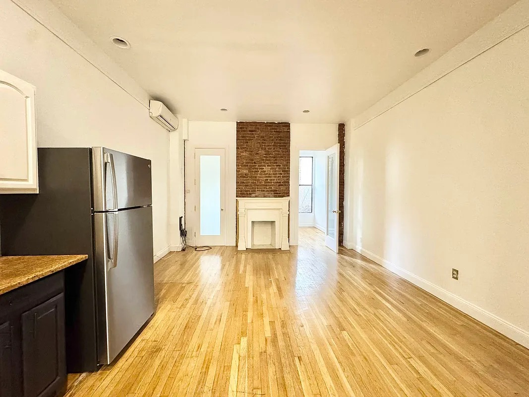 238 Gates Avenue, Unit 2 Brooklyn, NY 11238 - Photo 13 of 13 a view of a kitchen with a refrigerator and a stove