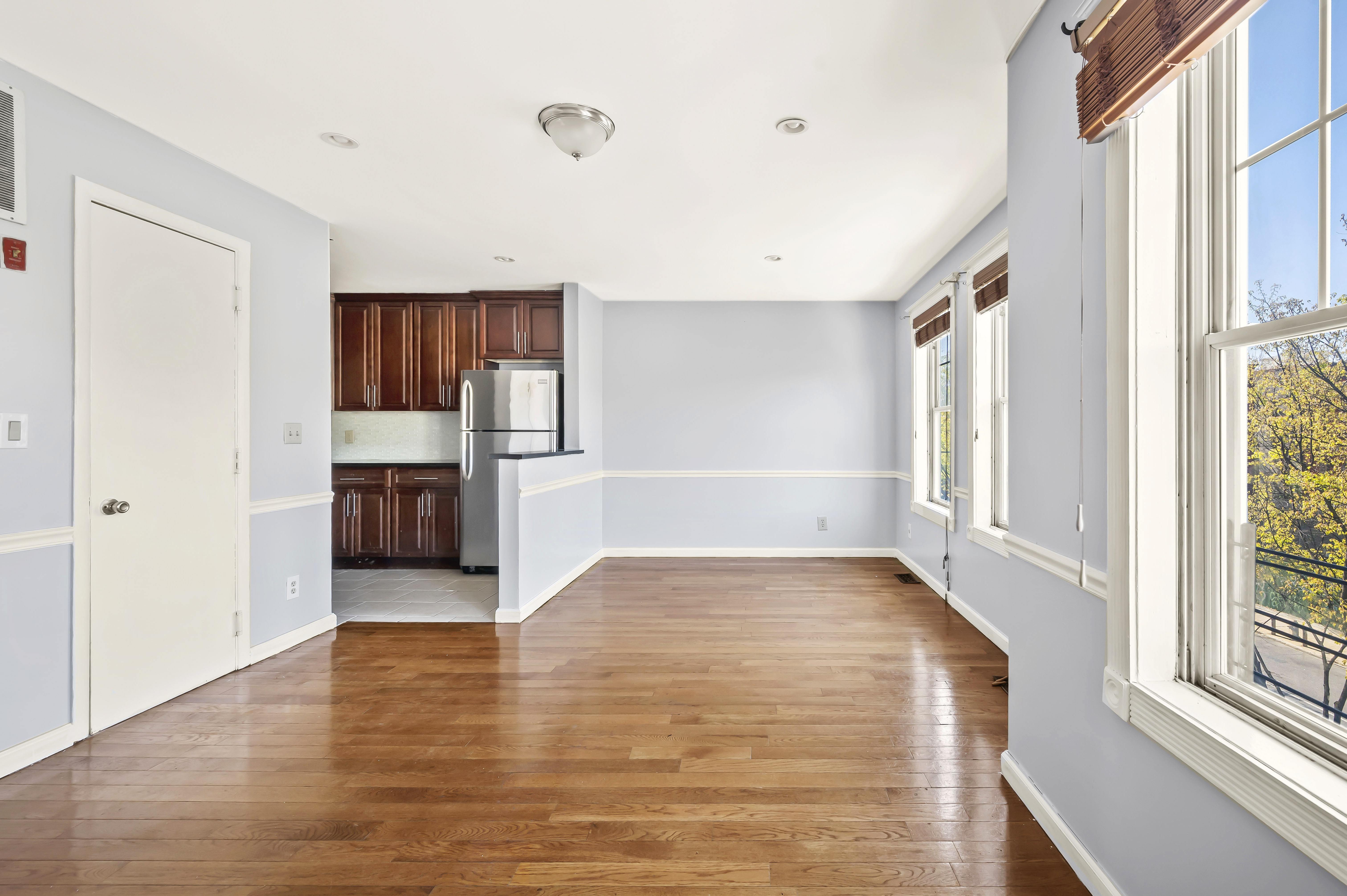 930 Jefferson Avenue, Unit 2 Brooklyn, NY 11221 - Photo 4 of 12 a view of empty room with wooden floor and window