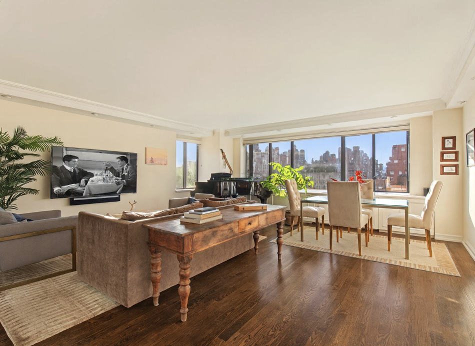 1441 3rd Avenue, Unit 14A Manhattan, NY 10028 - Photo 1 of 10 a dining room with furniture a window and wooden floor