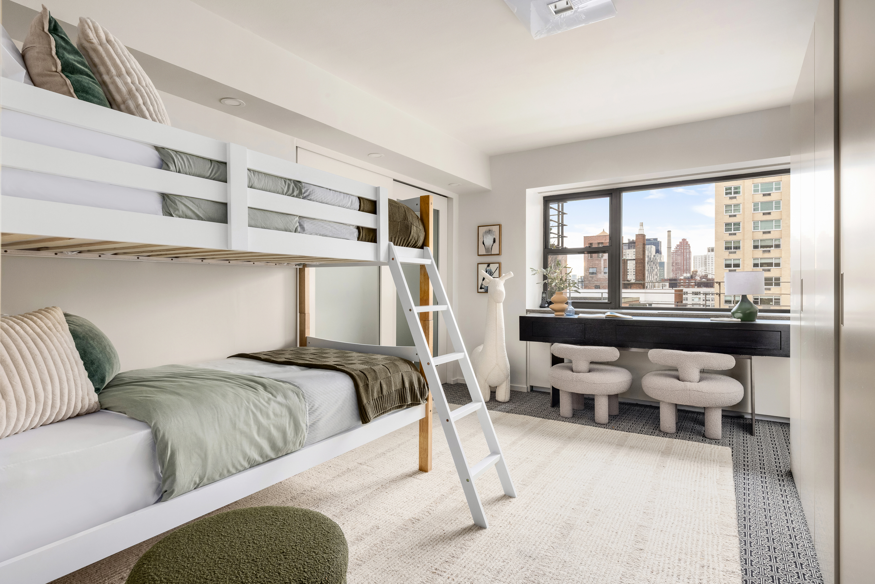 510 East 86th Street, Unit 17C Manhattan, NY 10028 - Photo 24 of 31 a living room with furniture and a large window
