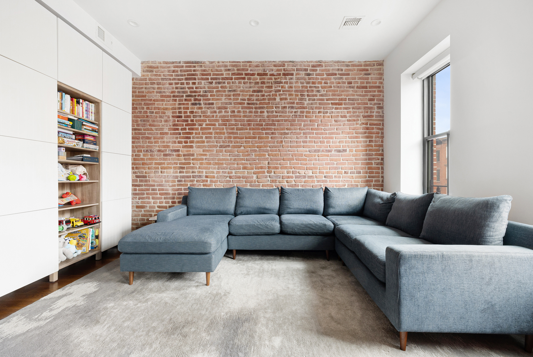 110 Summit Street, Unit 2 Brooklyn, NY 11231 - Photo 4 of 13 a living room with furniture and a window