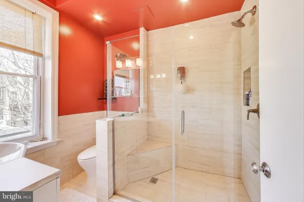 a bathroom with a bathtub and shower