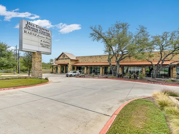 a front view of a building with garden