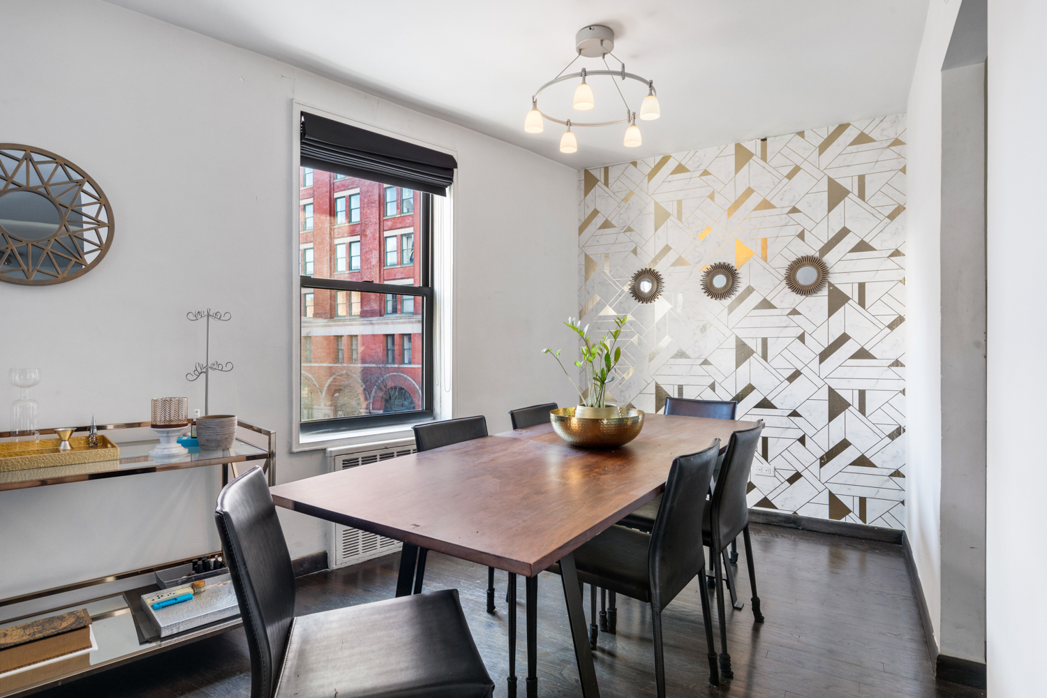 165 Christopher Street, Unit 3I Manhattan, NY 10014 - Photo 5 of 20 a view of a dining room with furniture and wooden floor