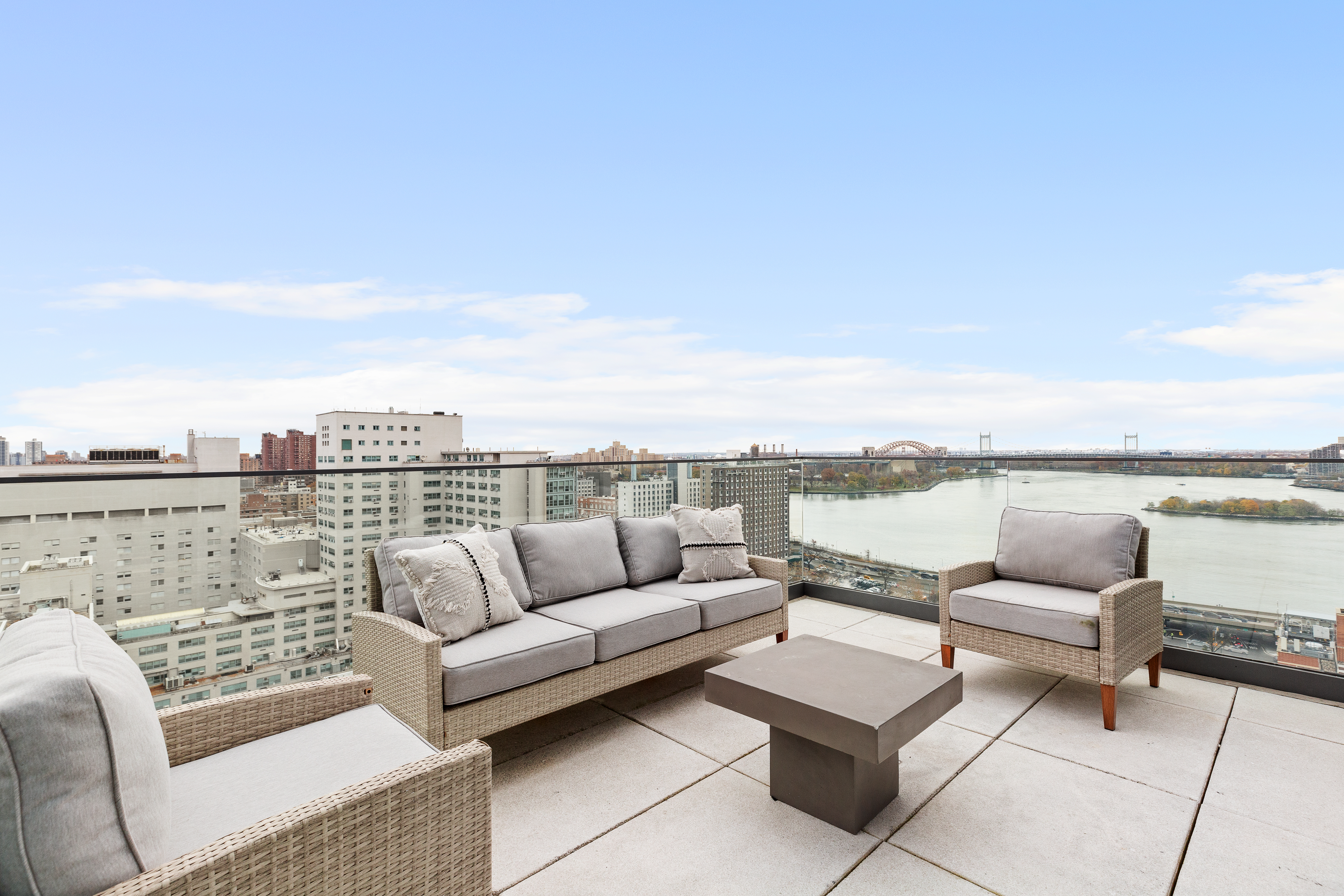 302 East 96th Street, Unit PH6 Manhattan, NY 10128 - Photo 5 of 13 a terrace view with seating space and ocean view