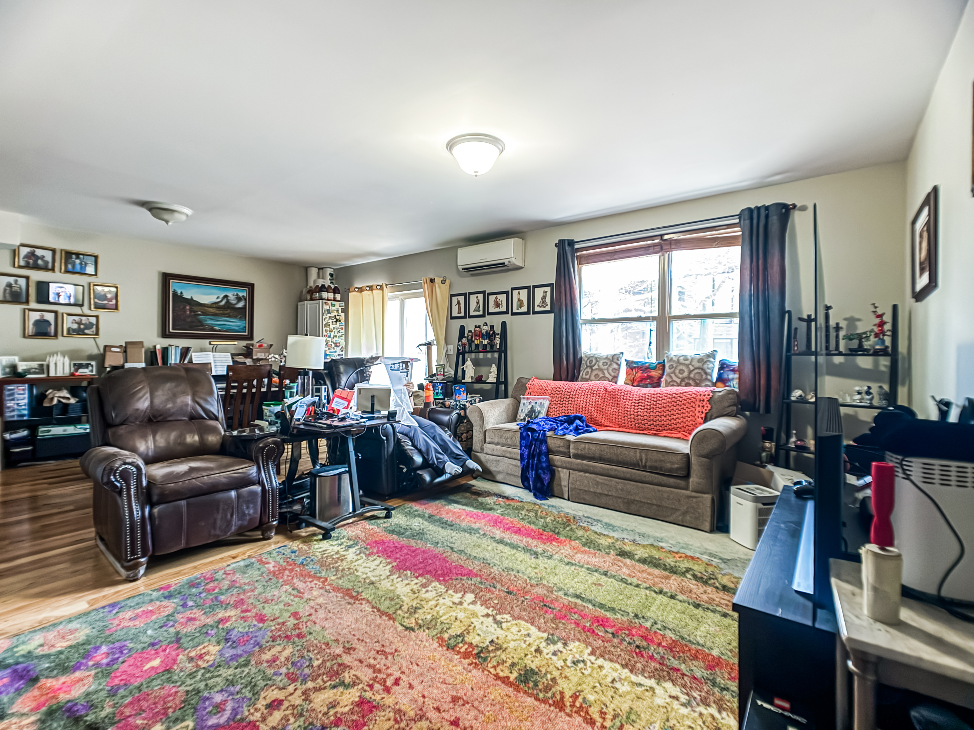 3827 28th Street Queens, NY 11101 - Photo 6 of 13 a living room with furniture fireplace and a window