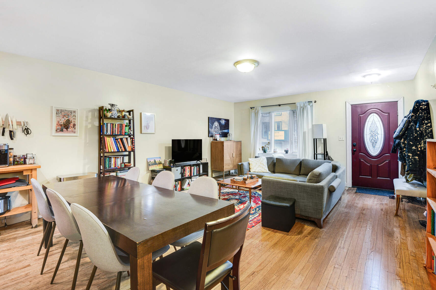585 Warren Street, Unit 2 Brooklyn, NY 11217 - Photo 3 of 12 a living room with furniture a rug and a flat screen tv