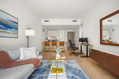 a living room with furniture and a table