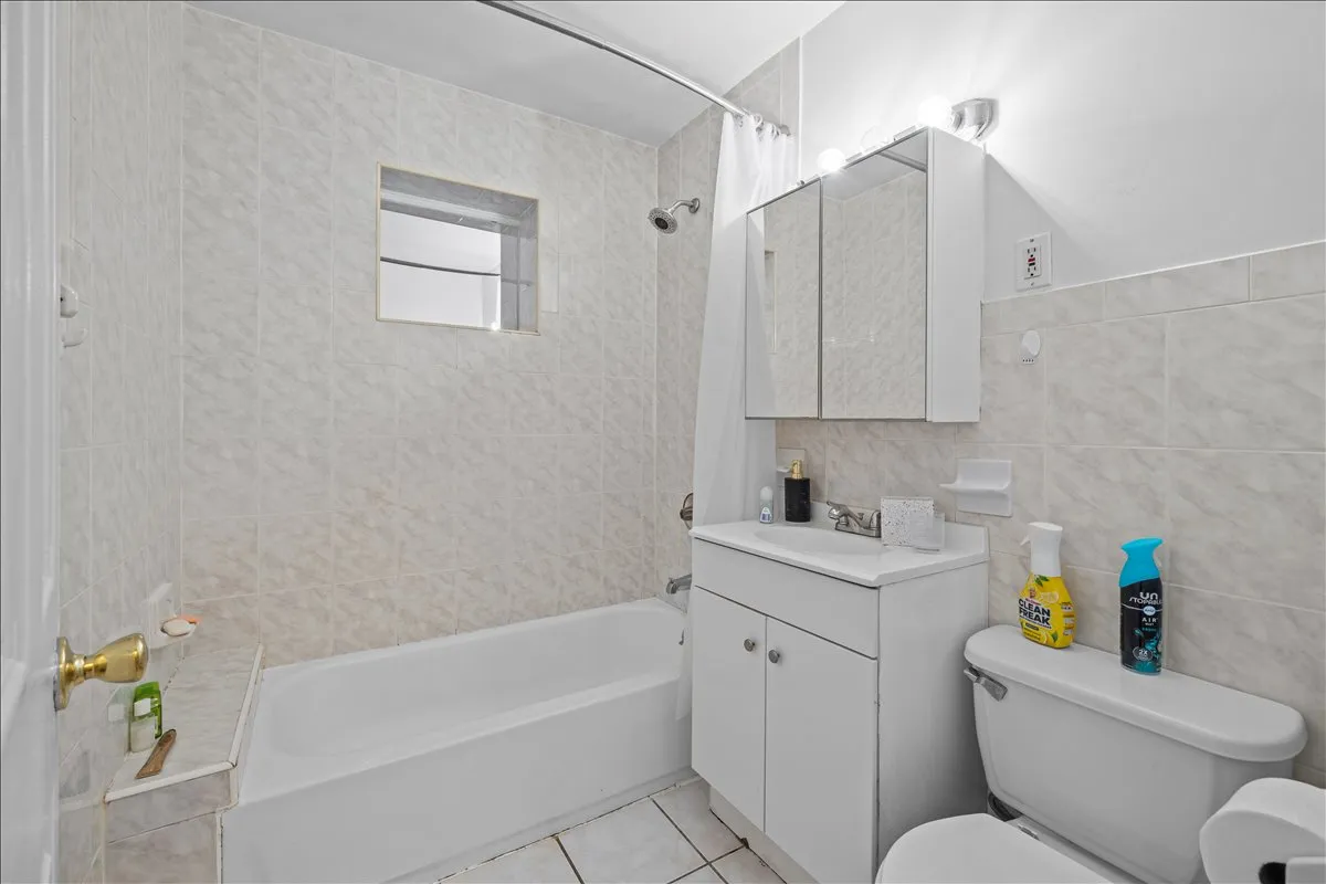 a kitchen with stainless steel appliances a stove a sink dishwasher and cabinets with wooden floor