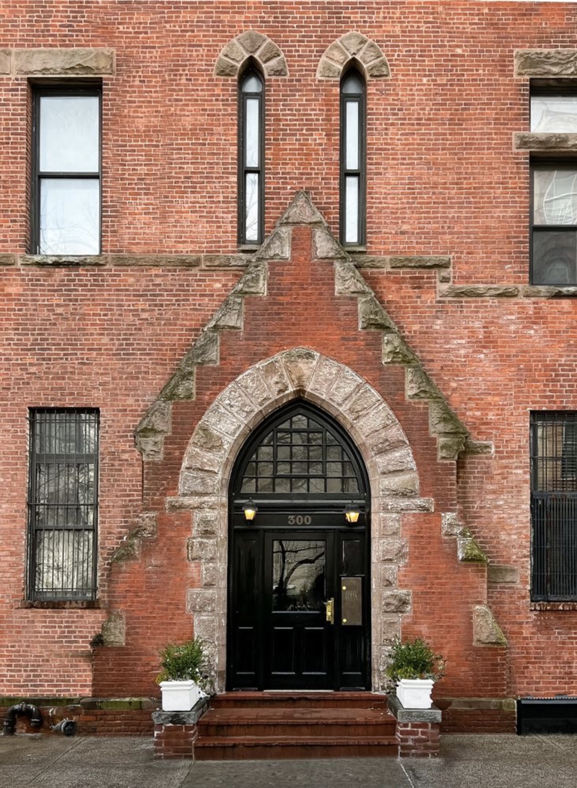 300 East 4th Street, Unit 2A Manhattan, NY 10009 - Photo 14 of 15 a front view of a house with garden