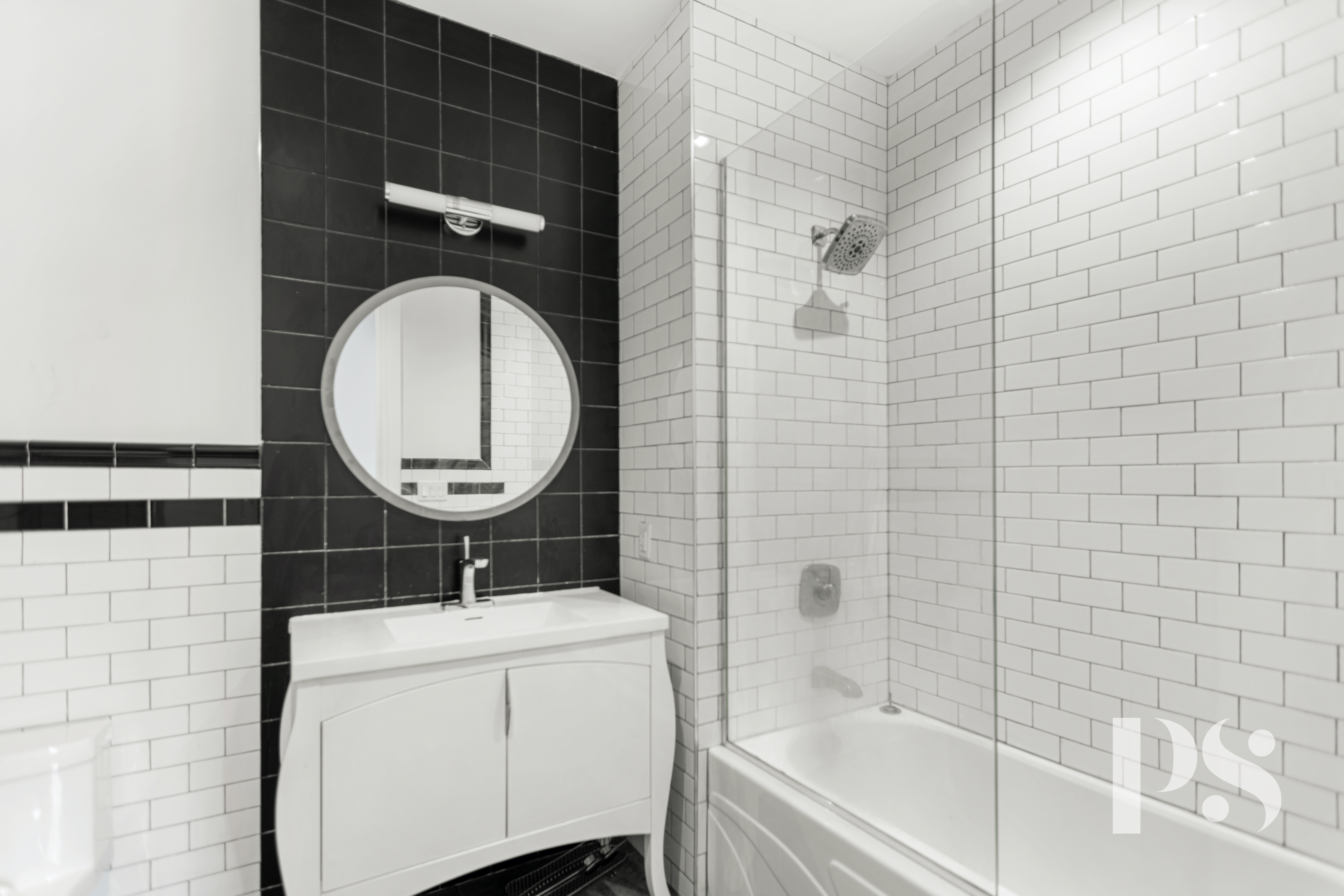 2 Wooster Street, Unit 5A Manhattan, NY 10013 - Photo 11 of 12 a bathroom with a sink a toilet and shower