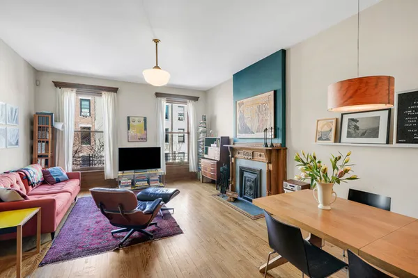 a living room with furniture fireplace and a flat screen tv