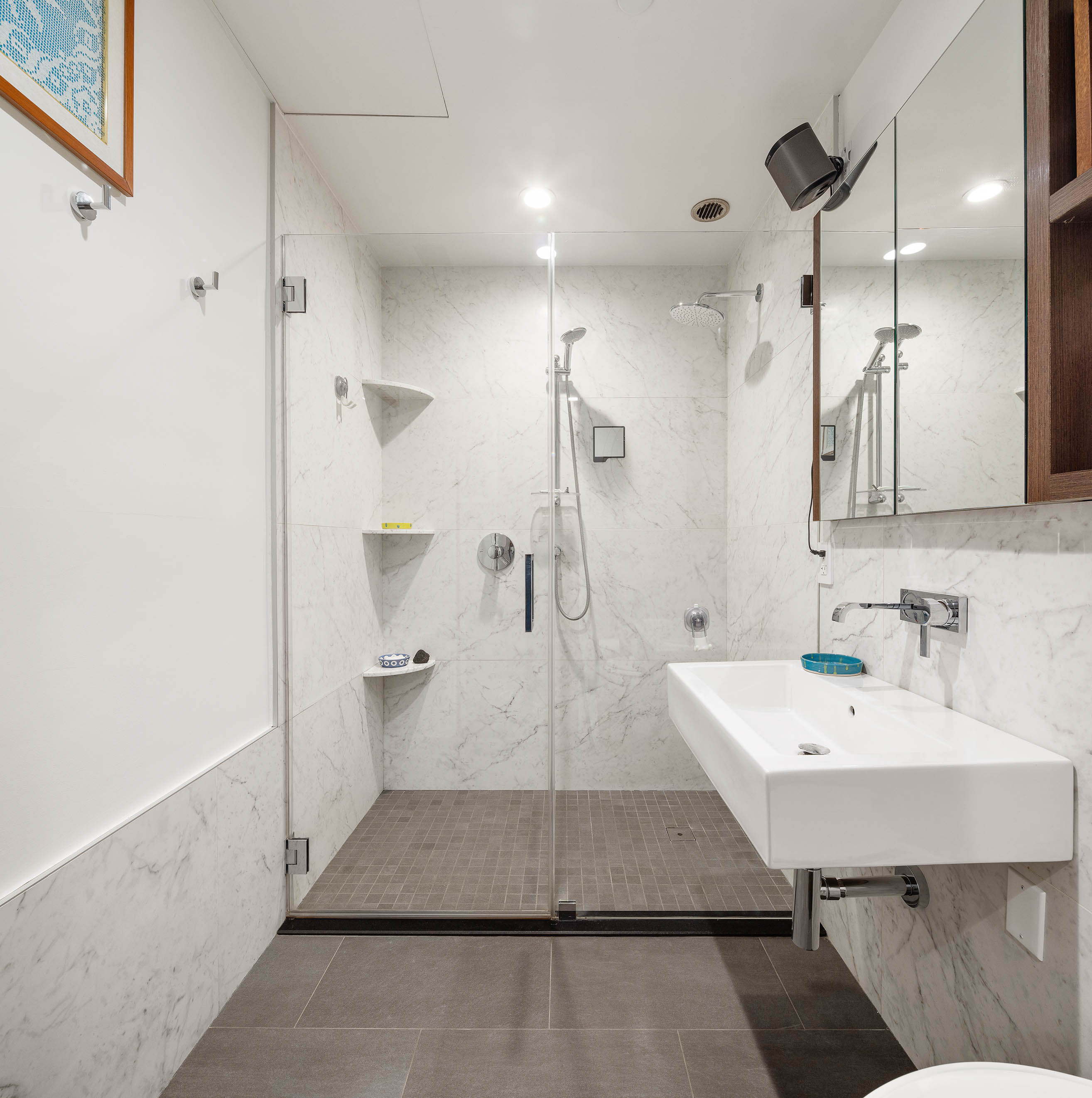 336 Saint Marks Avenue, Unit PH5A Brooklyn, NY 11238 - Photo 6 of 12 a bathroom with a sink and mirror