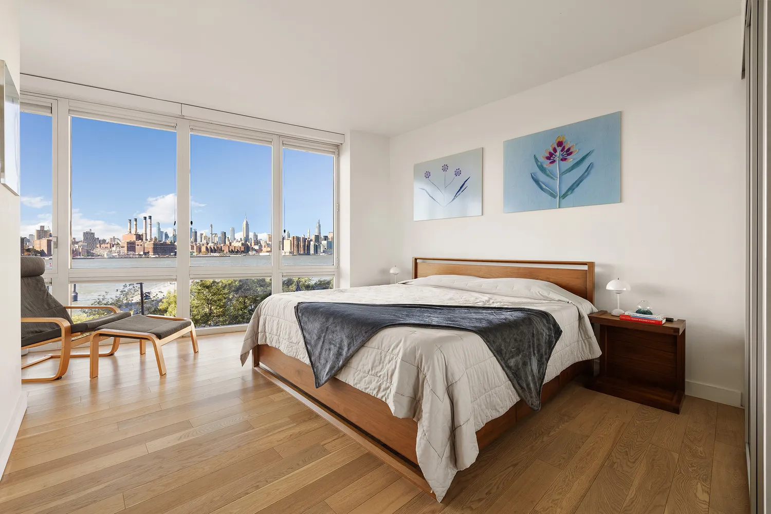 a spacious bedroom with a bed and a table in it