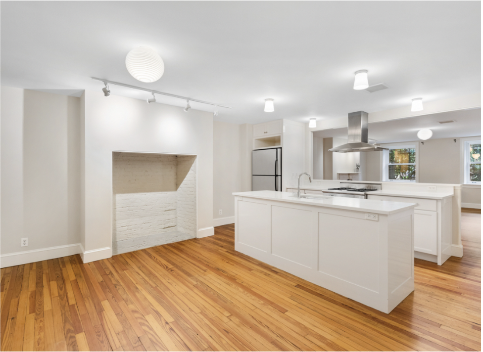 128 State Street, Unit GARDEN Brooklyn, NY 11201 - Photo 1 of 10 a large white kitchen with kitchen island a sink stainless steel appliances and cabinets