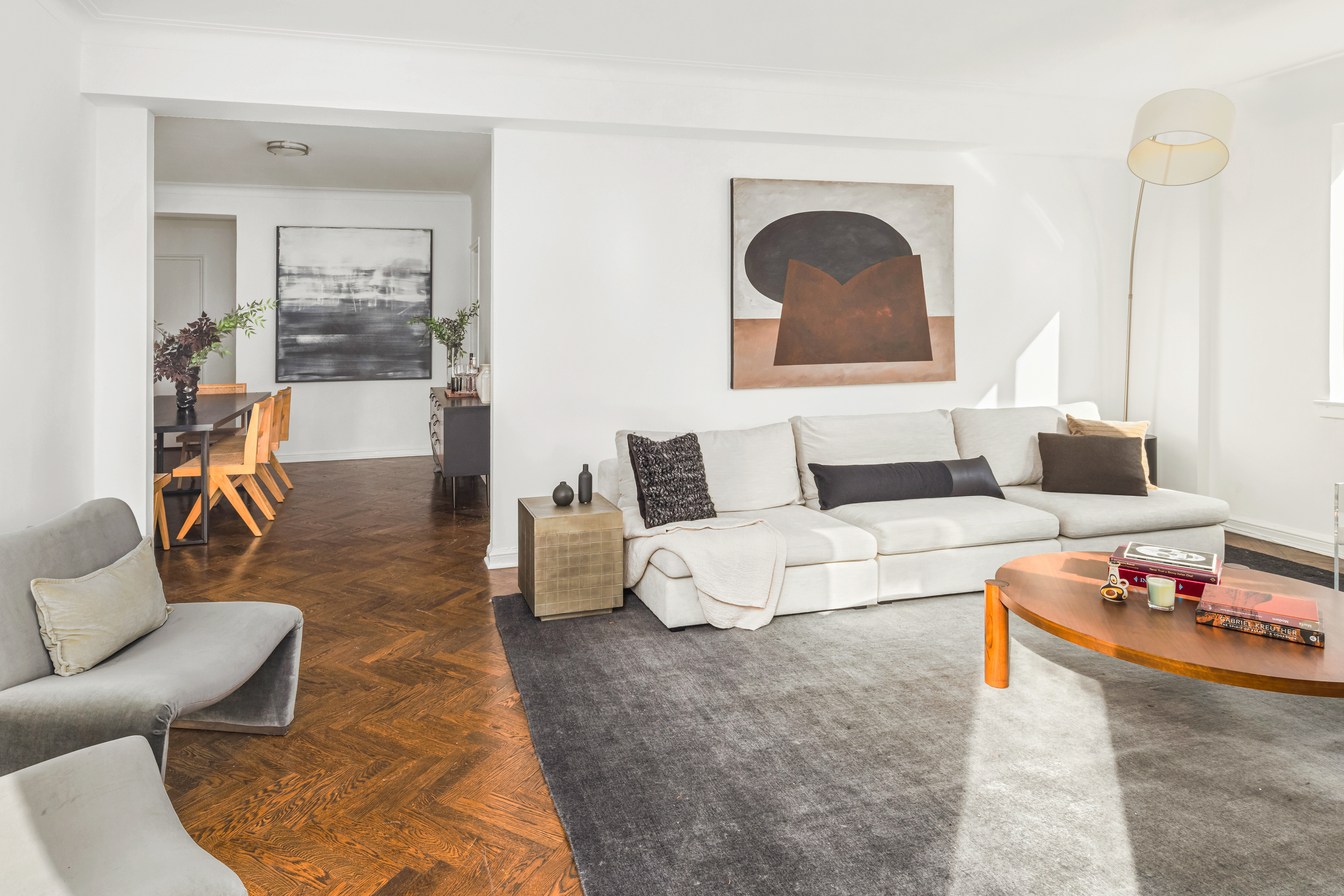 923 5th Avenue, Unit 10F Manhattan, NY 10021 - Photo 4 of 18 a living room with furniture and wooden floor