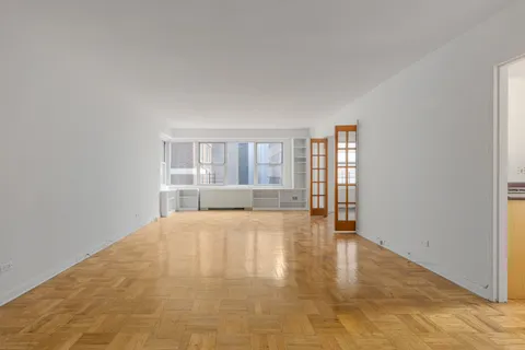 a view of an empty room with a window