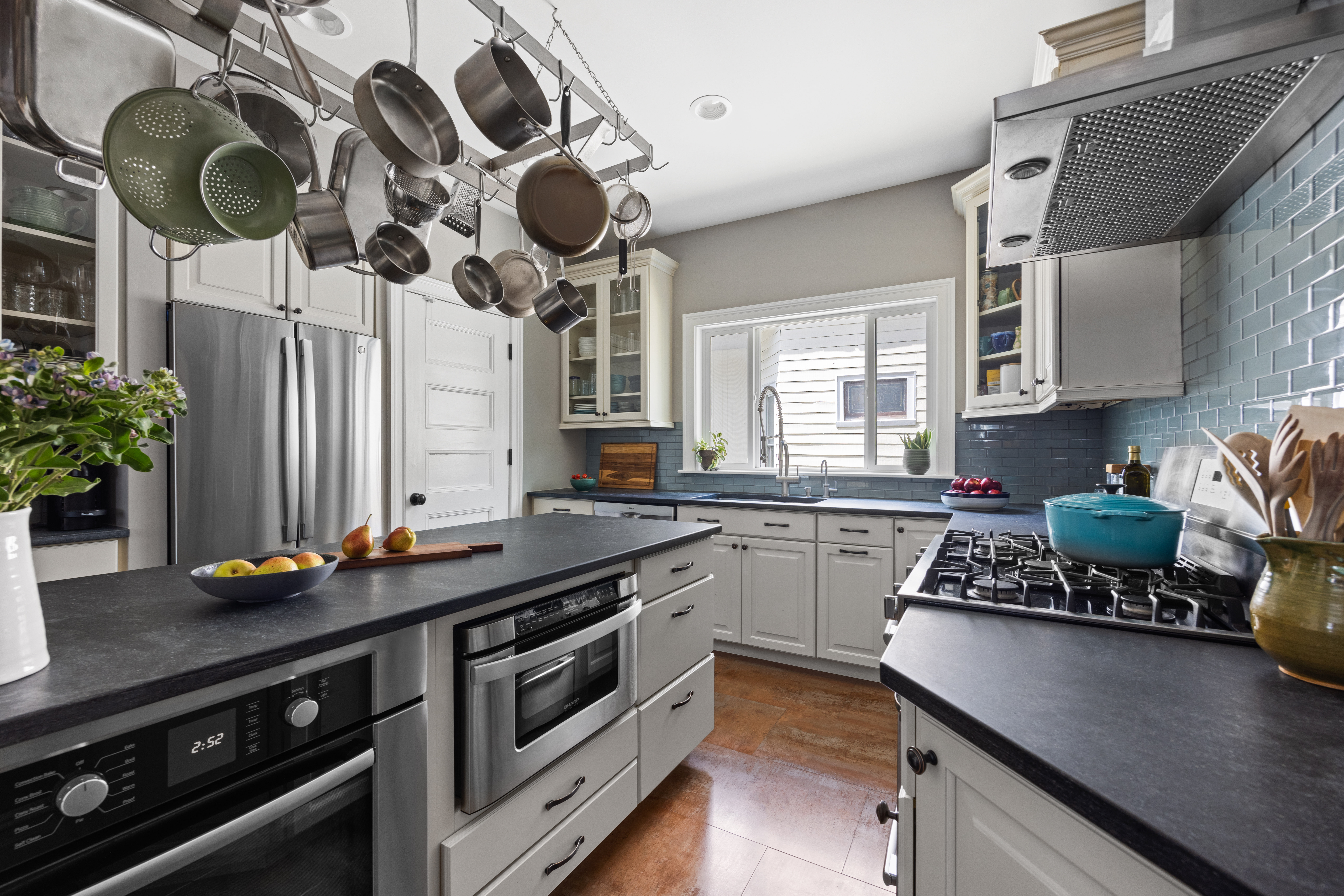 758 Westminster Road Brooklyn, NY 11230 - Photo 11 of 32 a kitchen with a stove a sink and a microwave