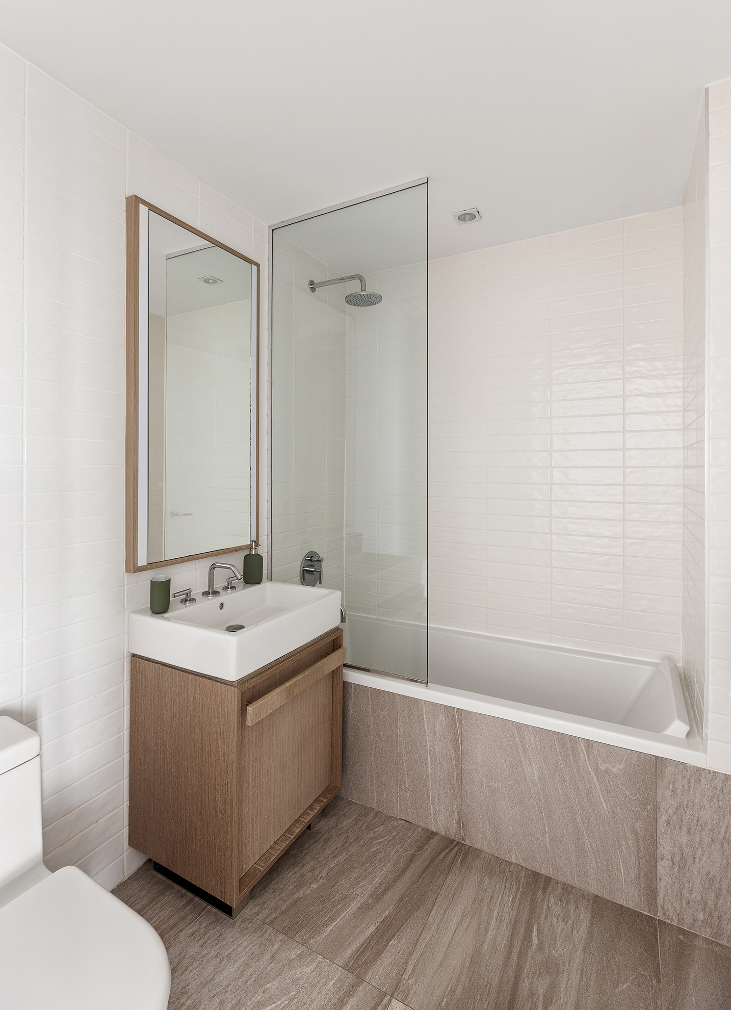 251 1st Street, Unit 7F Brooklyn, NY 11215 - Photo 14 of 24 a bathroom with a sink a toilet and shower