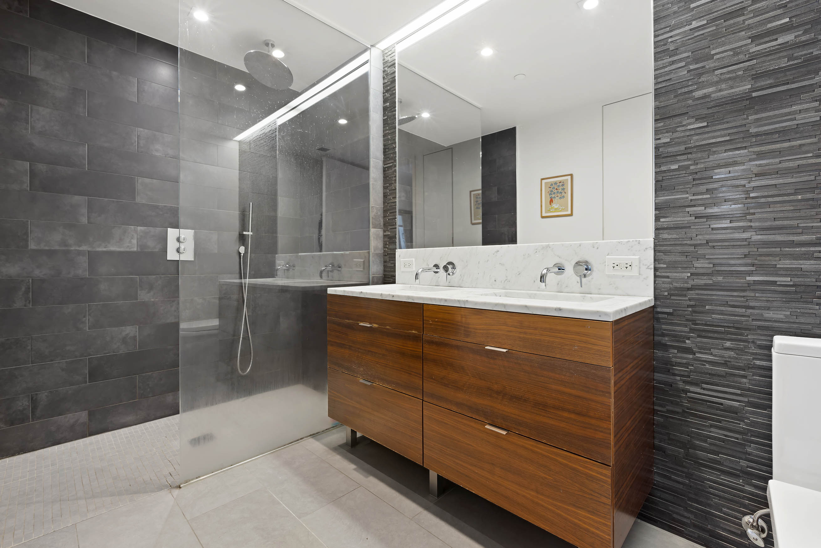 205 Water Street, Unit PHC Brooklyn, NY 11201 - Photo 8 of 14 a bathroom with a sink mirror and shower
