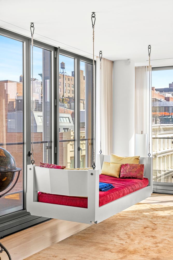 a bedroom with a bed and a mirror