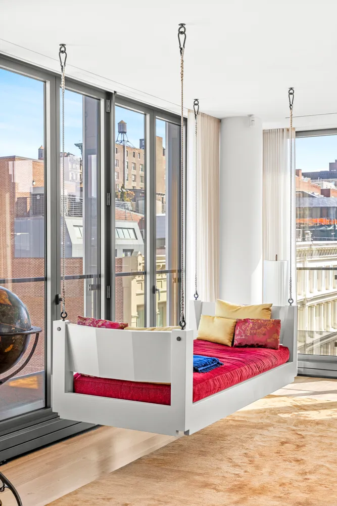 a bedroom with a bed and a mirror