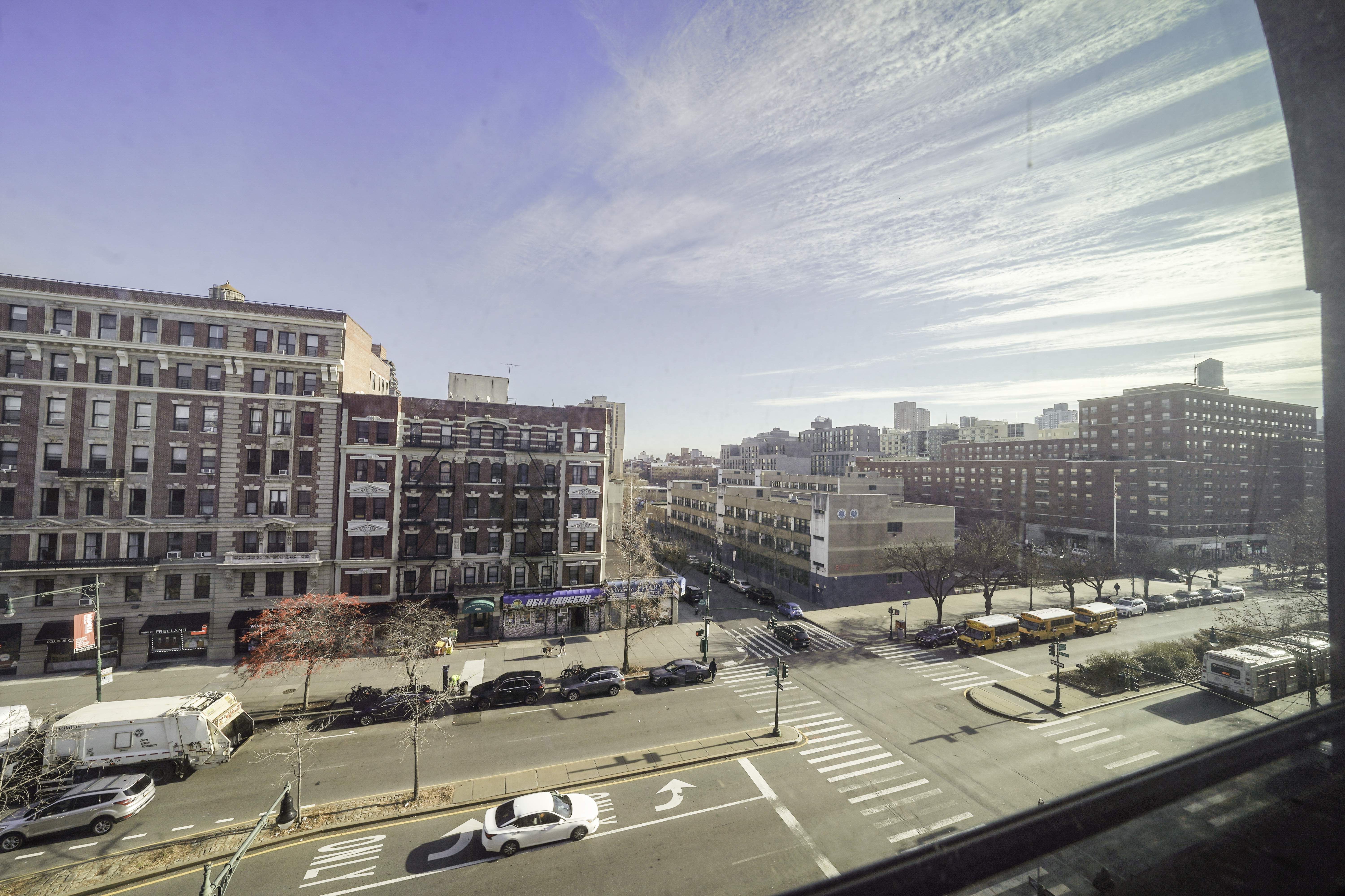 163 Lenox Avenue, Unit 5A Manhattan, NY 10026 - Photo 6 of 16 a view of a city that has tall buildings